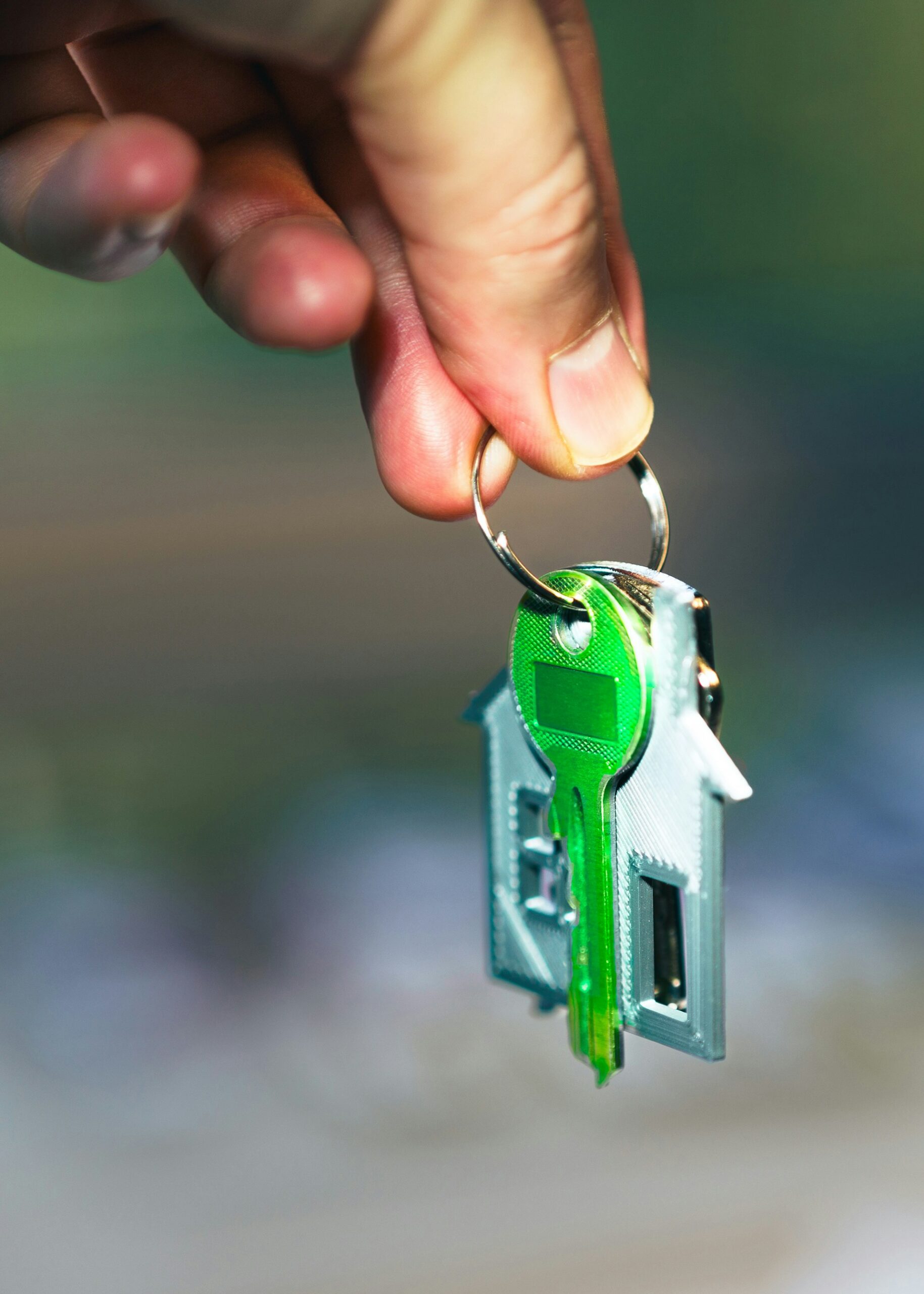Keys with a house keyring and green key